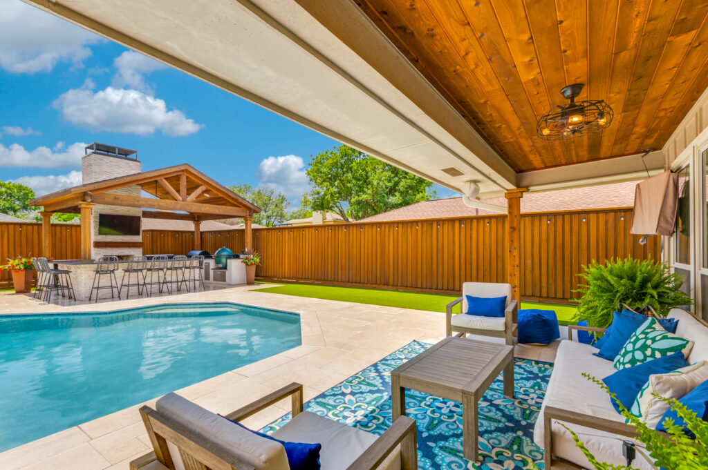 image of outdoor livingroom with pool in front